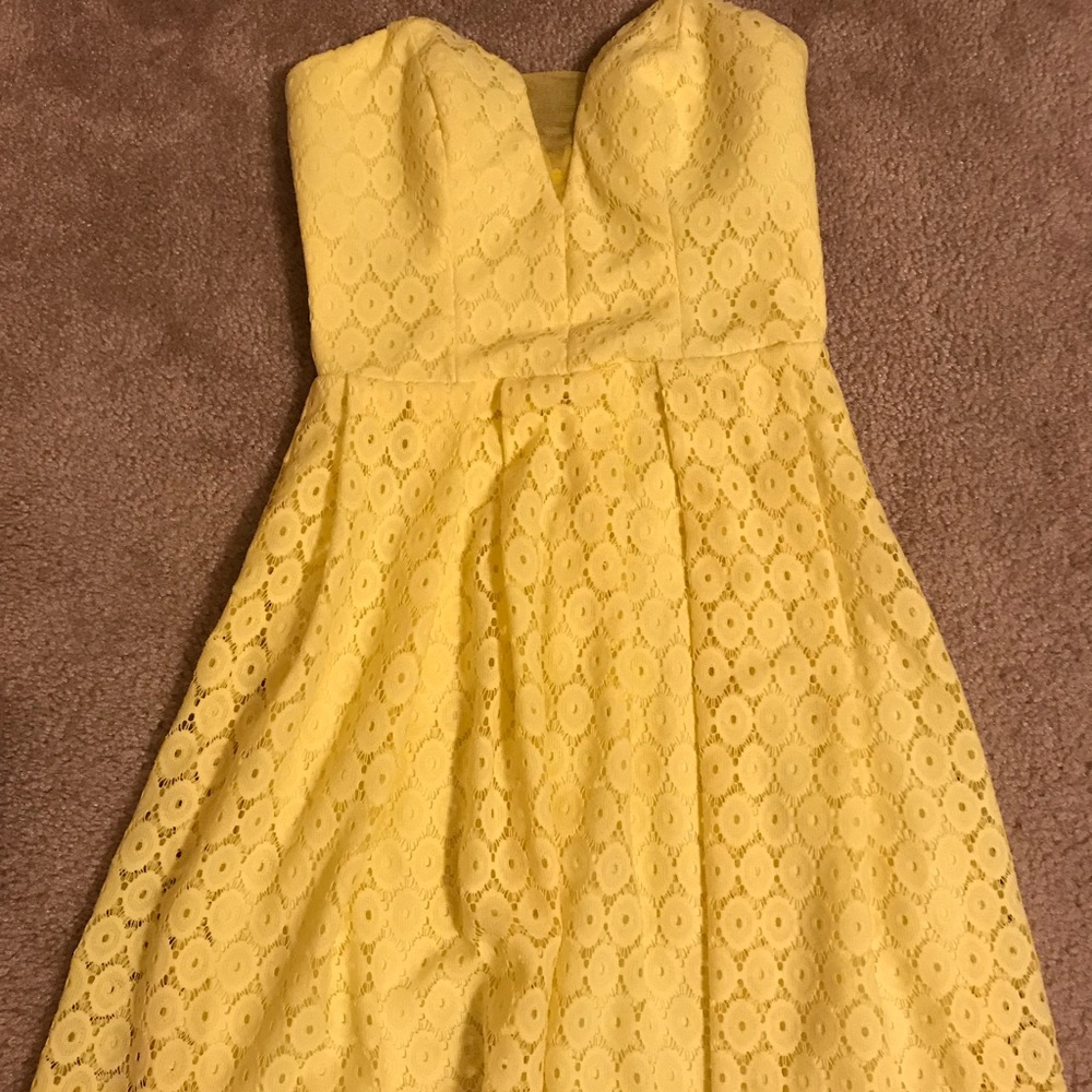 Yellow “above the knee” dress.